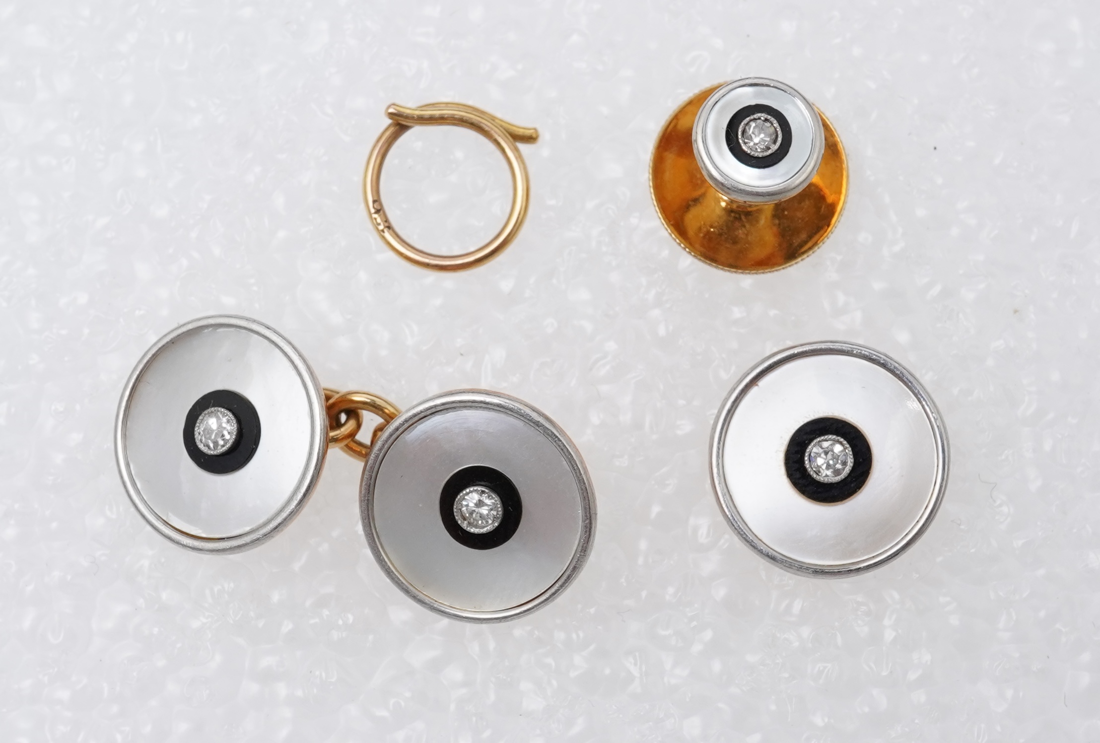 An Art Deco mother of pearl, onyx and diamond dress set, early 20th century